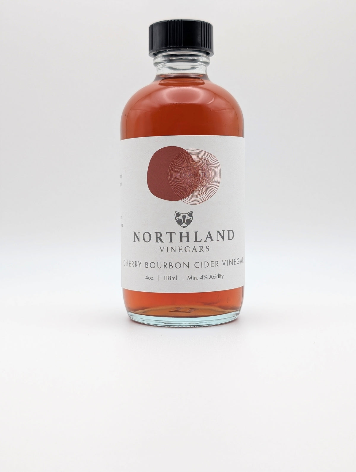 Bottle of Northland Vinegars Cherry Bourbon Cider Vinegar on a white background